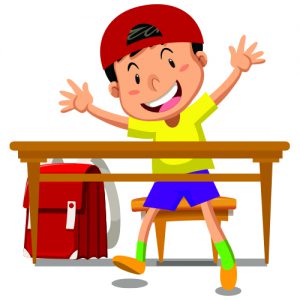 Boy with ballcap and backpack sitting at a desk Boy with ballcap and backpack sitting at a desk